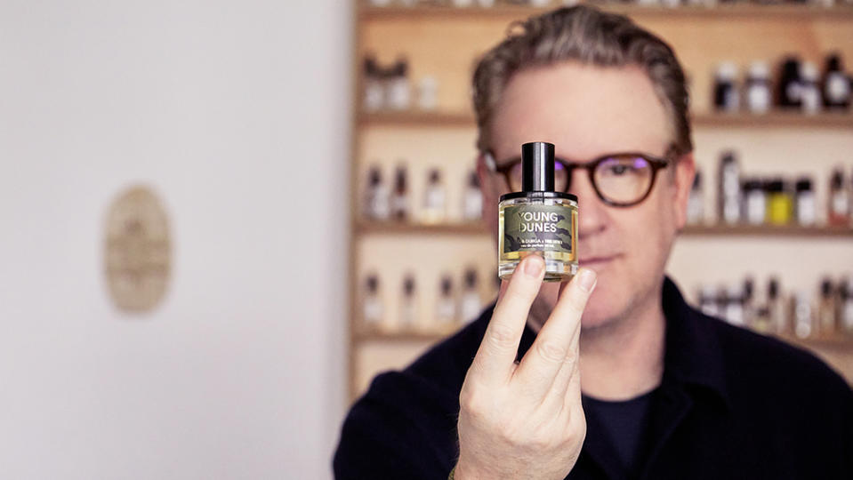 Todd Snyder holding Young Dunes, his first fragrance with D.S. & Durga.
