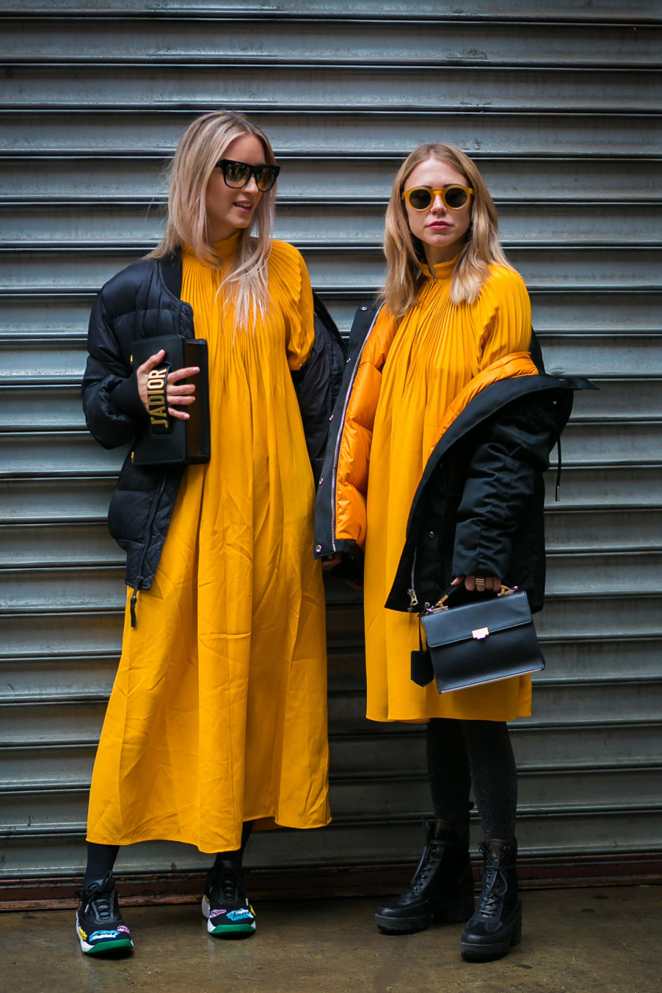 Charlotte Groeneveld and Courtney Trop twin in saffron at New York Fashion Week.