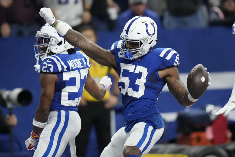 Indianapolis Colts outside linebacker Darius Leonard (53) celebrates alongside teammate Nyheim Hines (21) after intercepting a pass during the first half of an NFL football game against the New England Patriots Saturday, Dec. 18, 2021, in Indianapolis. (AP Photo/AJ Mast)