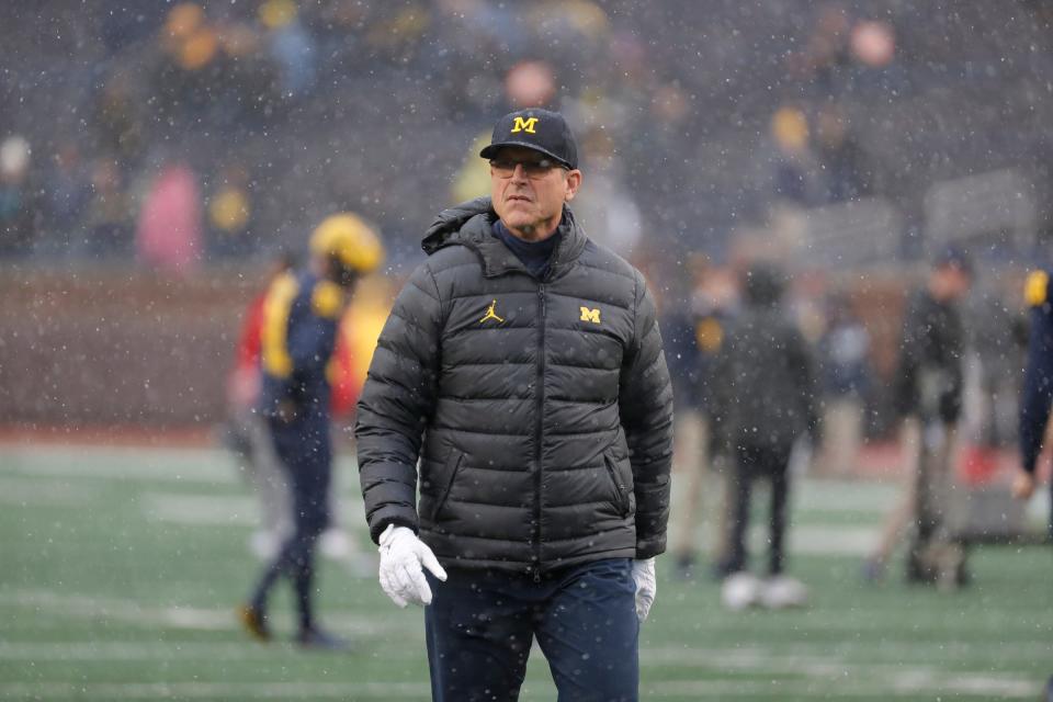 Michigan coach Jim Harbaugh watches warm up before the Nebraska game in Ann Arbor on Saturday, Nov. 12, 2022.