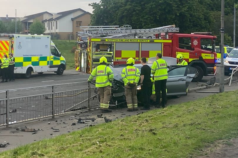 The car had battered through the railing -Credit:Lanarkshire Live