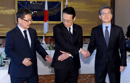 U.S. Special Representative for North Korea Policy Joseph Yun (L), Japanese Ministry of Foreign Affairs Director General for Asian and Oceanian Affairs Kenji Kanasugi (C) and South Korean Special Representative for Korean Peninsula Peace and Security Affairs Kim Hong-kyun pose for photographs before their meeting to talk about North Korean issues at the Iikura guest house in Tokyo, Japan April 25, 2017. REUTERS/Toru Yamanaka/Pool