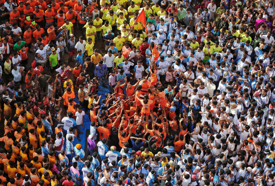 <p>Devotees form a human pyramid to celebrate the festival of Janmashtami, marking the birth anniversary of Hindu Lord Krishna, in Mumbai, India Aug. 25, 2016. (Photo: Shailesh Andrade/Reuters) </p>