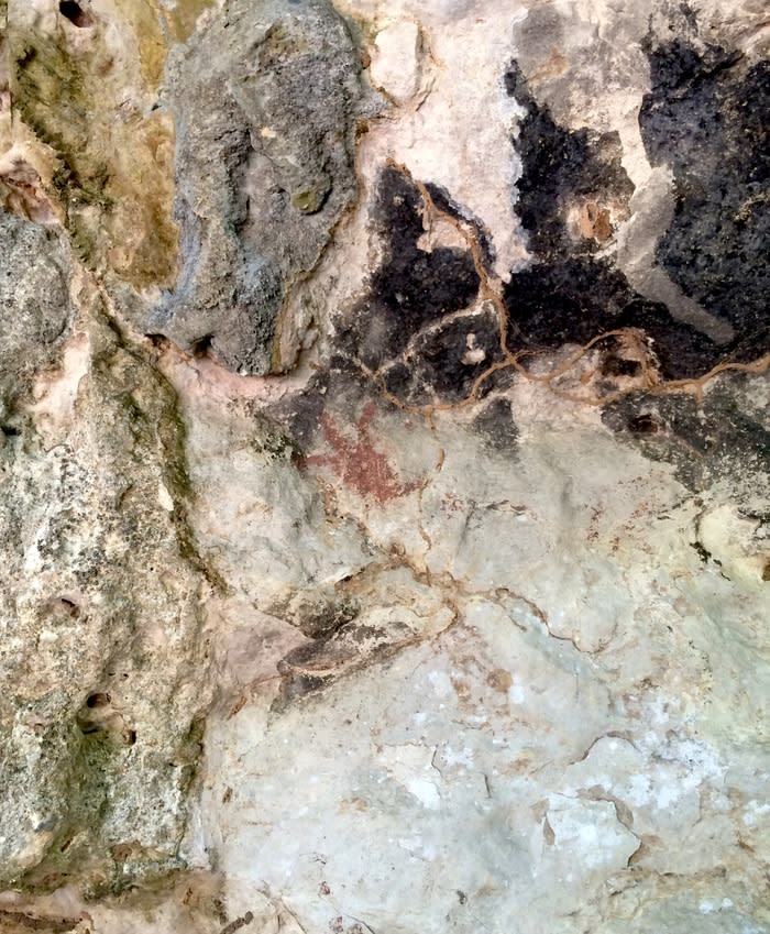 Fresco: The almost faded prehistorical fresco inside the cave.