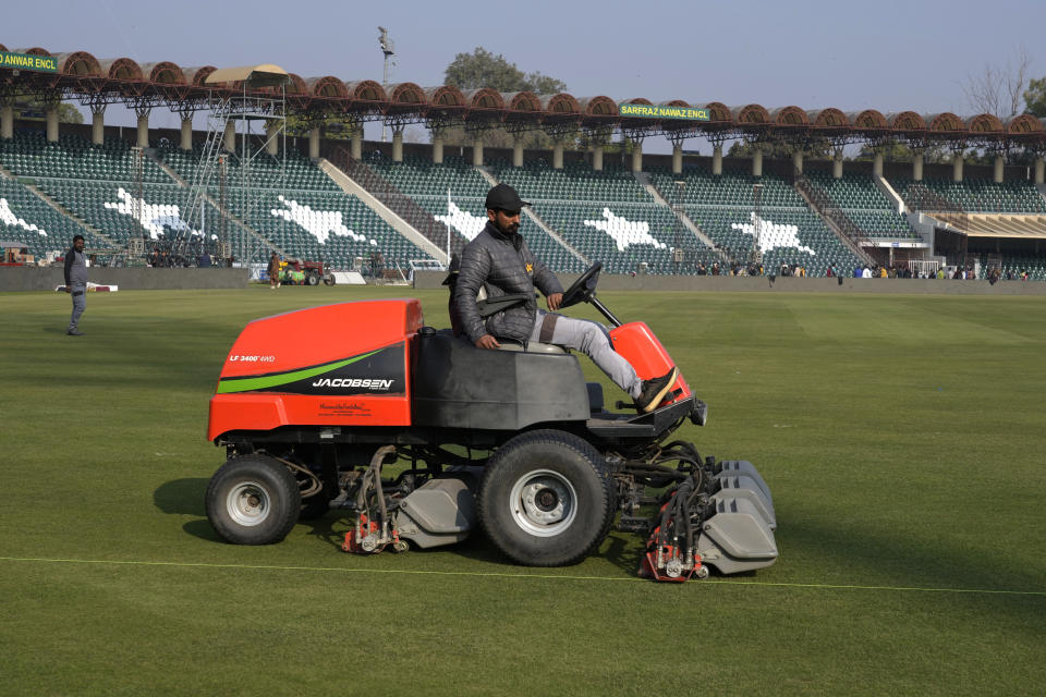 A member of ground staff prepare ground for upcoming Pakistan Super League T20 cricket tournament, in Lahore, Pakistan, Wednesday, Feb. 14, 2024. Young aspiring fast bowlers such as Shamar Joseph of West Indies will showcase their skills in Pakistan's premier domestic Twenty20 competition starting this weekend. (AP Photo/K.M. Chaudary)