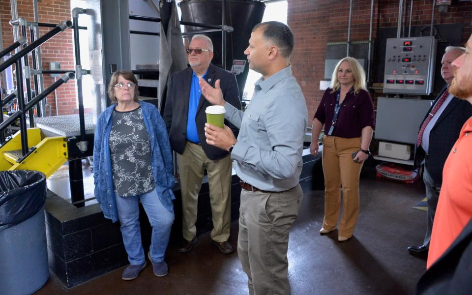 Matt Carr, center, supervisor of the R.C. Willson Water Treatment Plant near Williamsport, leads county and city officials on a tour of the plant Thursday.