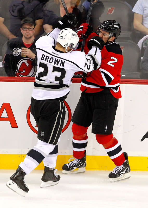 NEWARK, NJ - JUNE 02: Dustin Brown #23 of the Los Angeles Kings collides with Marek Zidlicky #2 of the New Jersey Devils during Game Two of the 2012 NHL Stanley Cup Final at the Prudential Center on June 2, 2012 in Newark, New Jersey. (Photo by Paul Bereswill/Getty Images)