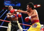 May 2, 2015; Las Vegas, NV, USA; Floyd Mayweather and Manny Pacquiao box during their world welterweight championship bout at MGM Grand Garden Arena. Mandatory Credit: Mark J. Rebilas-USA TODAY Sports