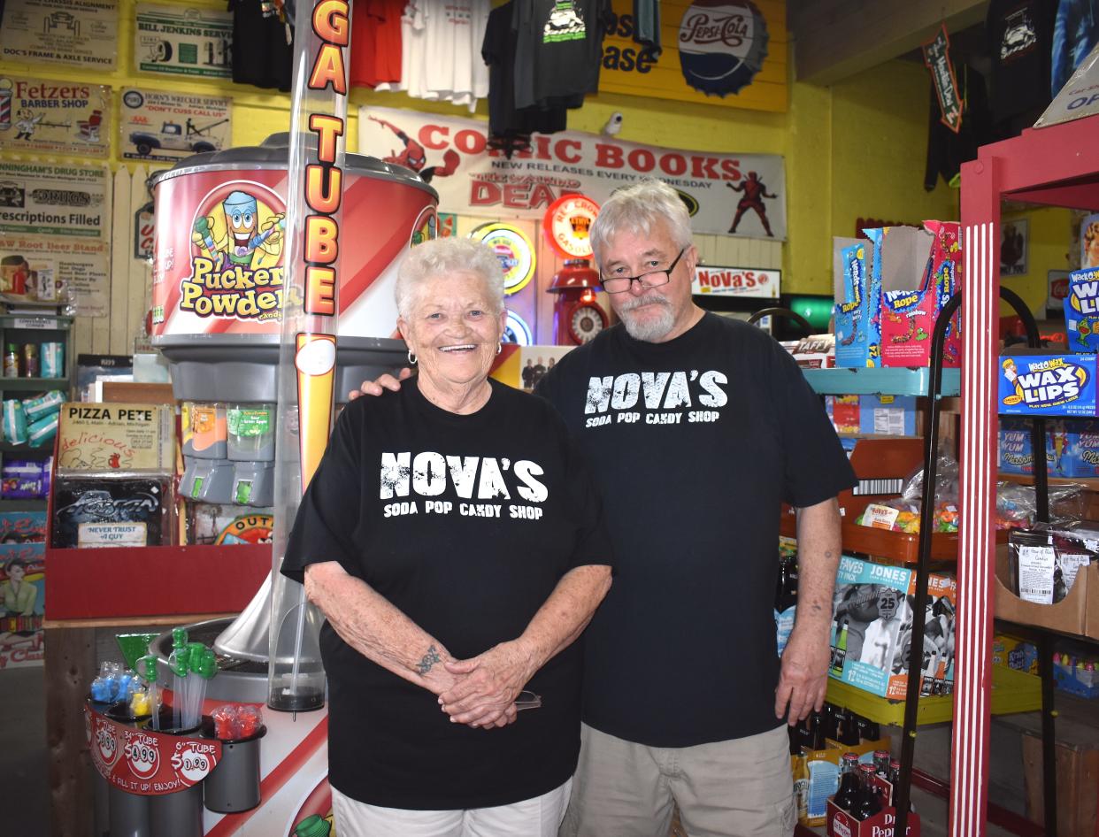 David Spencley, right, co-owner of Nova's Soda Pop Candy Shop at 105 E. Church St. in Adrian, stands alongside his older sister and store employee Sharon Hawkins inside the business Tuesday, Aug. 9, 2022. Nova's is celebrating 20 years in business this month.