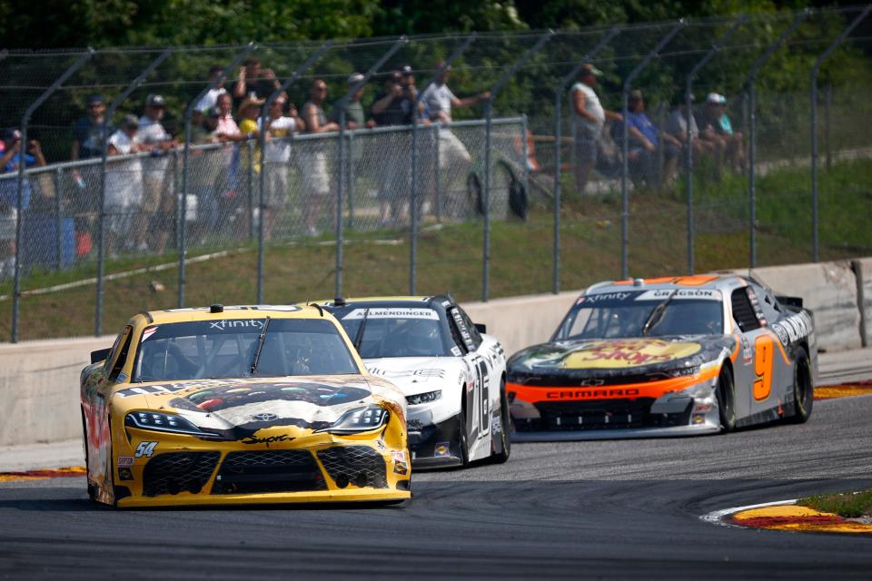 Kyle Busch leads the field during through Turn 5 on the way to winning the 2021 Henry 180.