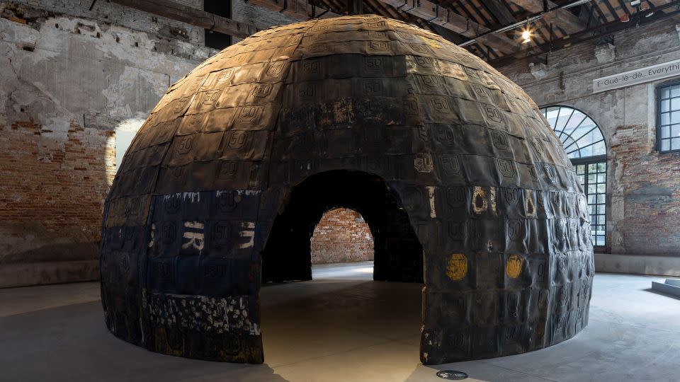Romuald Hazoumé's centerpiece for the Benin Pavilion features his signature masks using petrol containers, inside and out. - Jacopo La Forgia