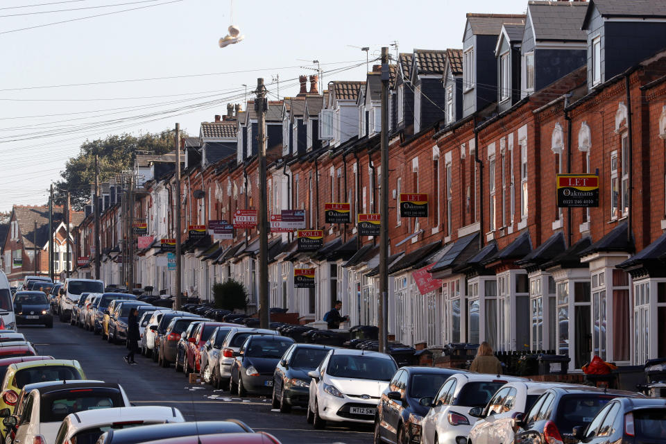 Estate agent's signs hang from houses in the Selly Oak area of Birmingham, Britain September 25, 2018. REUTERS/Darren Staples