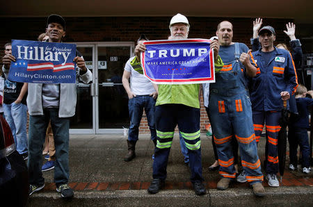 Supporters of U.S. Democratic presidential candidate Hillary Clinton and Republican presidential Donald Trump cheer outside a campaign event in Williamson, West Virginia, United States, May 2, 2016. REUTERS/Jim Young