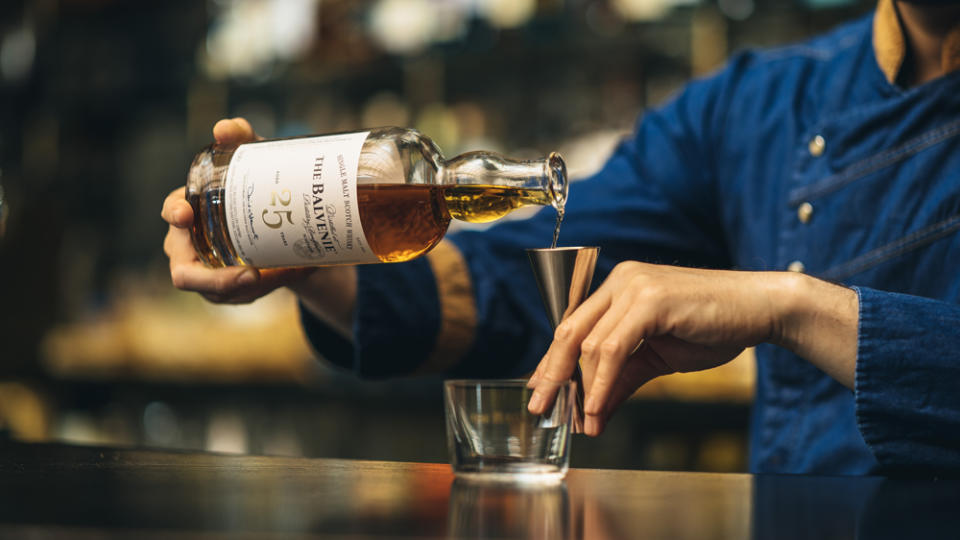 bartender pouring single malt scotch neat balvenie