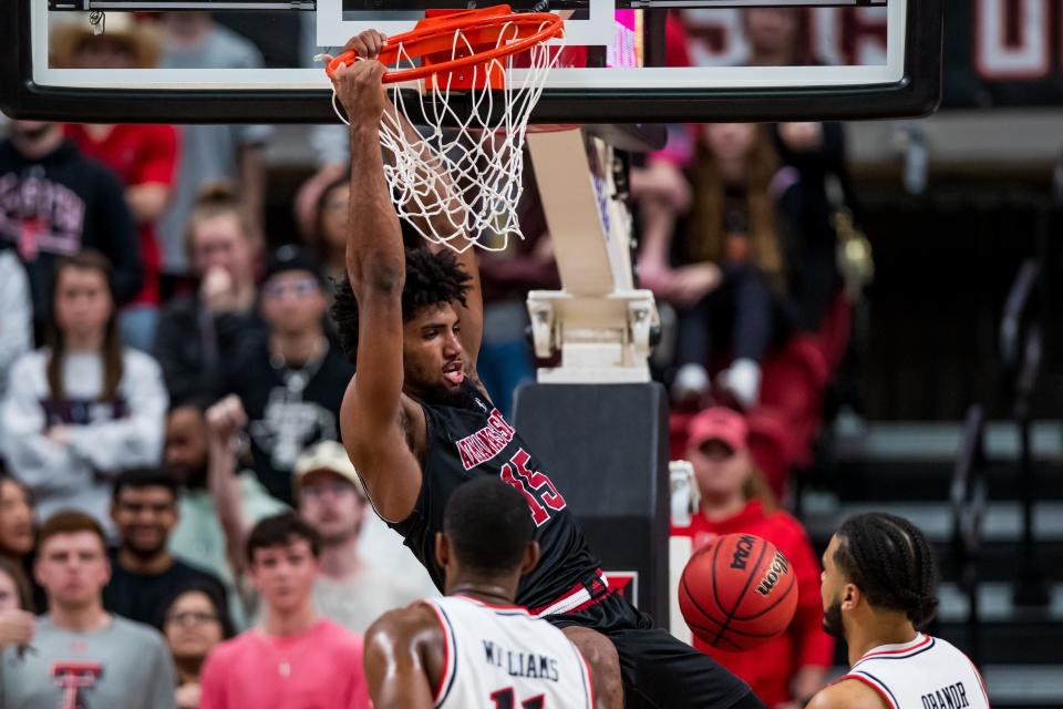 LUBBOCK, TEXAS - DECEMBER 14: Forward Norchad Omier #15 of the Arkansas State Red Wolves dunks the ball during the second half of the college basketball game against the Texas Tech Red Raiders at United Supermarkets Arena on December 14, 2021 in Lubbock, Texas. (Photo by John E. Moore III/Getty Images) ORG XMIT: 775730448 ORIG FILE ID: 1359061967