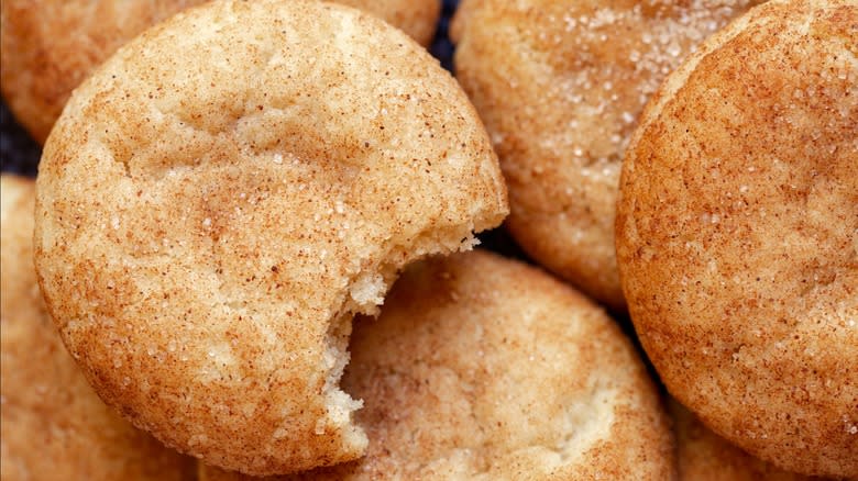 Top-down view of a snickerdoodle with a bite taken out of it