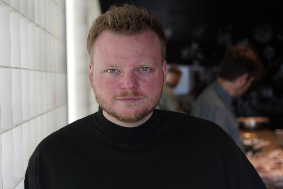 Rasmus Munk, co-owner and chef of Alchemist restaurant, poses inside Alchemist’s kitchen, in Copenhagen, Denmark, Monday May 6, 2024. The Danish Michelin-starred chef has teamed up with the Florida-based startup Space Perspective to take fine-dining to our upper atmosphere in late 2025. Six guests are set to ascend to the stratosphere, where they will enjoy an immersive dining experience served up by chef Rasmus Munk. (AP Photo/James Brooks)