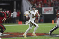 New Orleans Saints quarterback Andy Dalton (14) scrambles in the first half of an NFL football game against the Tampa Bay Buccaneers in Tampa, Fla., Monday, Dec. 5, 2022. (AP Photo/Mark LoMoglio)