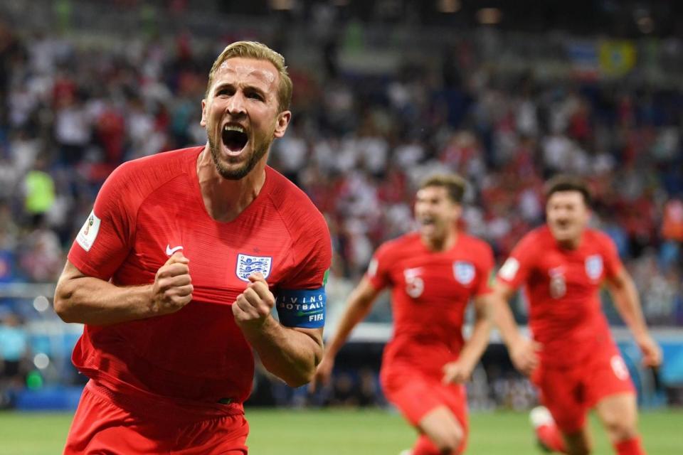 Harry Kane celebrates after scoring England's second goal in the team's opening World Cup fixture (Getty Images)