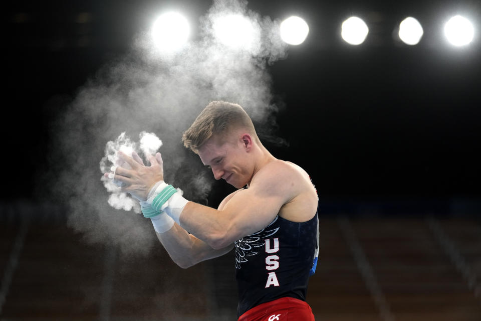 Shane Wiskus, of the United States, reacts after finishing his performance on the rings during the artistic gymnastic men's team final at the 2020 Summer Olympics, Monday, July 26, 2021, in Tokyo. (AP Photo/Gregory Bull)