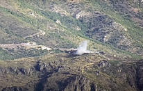 This photo taken from a footage distributed by Armenian Defense Ministry Press Service on July 14, 2020, shows the smoke from the explosions of the shelling by Armenian forces in the Tovuz region of Azerbaijan. Skirmishes on the volatile Armenia-Azerbaijan border escalated Tuesday, marking the most serious outbreak of hostilities between the neighbors since the fighting in 2016. (Armenian Defense Ministry Press Service via AP)