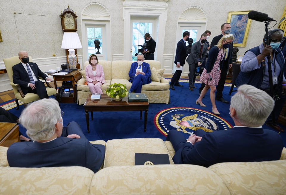 Members of the media are escorted out as President Joe Biden meets with congressional leaders in the Oval Office of the White House, Wednesday, May 12, 2021, in Washington. Clockwise from left, Biden, House Speaker Nancy Pelosi of Calif., and Senate Majority Leader Chuck Schumer of N.Y., Senate Minority Leader Mitch McConnell of Ky., and House Minority Leader Kevin McCarthy of Calif. (AP Photo/Evan Vucci)