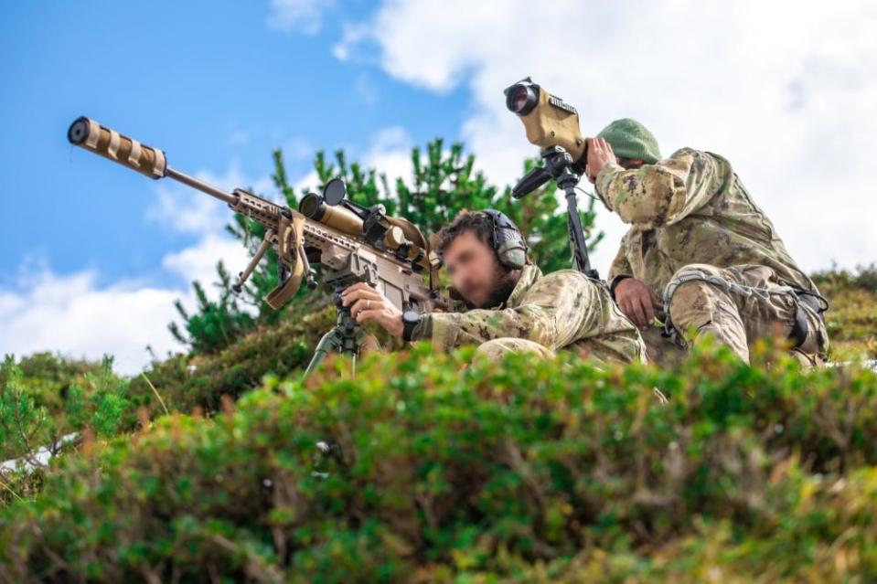 An Italian Special Forces Sniper team engage targets