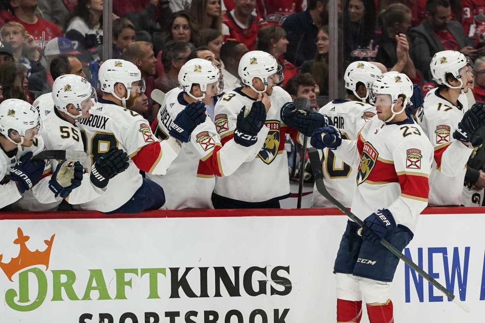 Florida Panthers center Carter Verhaeghe (23) celebrates his goal with his teammates during the first period of Game 4 in the first-round of the NHL Stanley Cup hockey playoffs against the Washington Capitals, Monday, May 9, 2022, in Washington. (AP Photo/Alex Brandon)