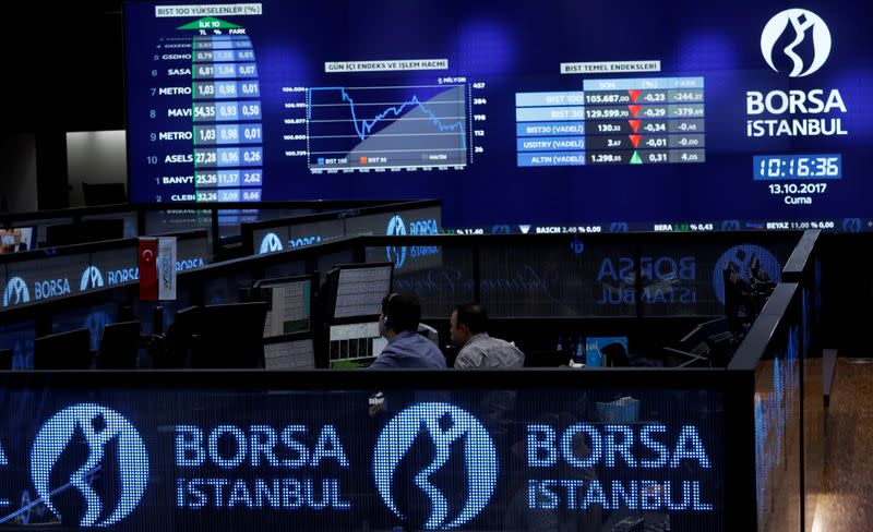 FILE PHOTO: Traders work at their desks on the floor of the Borsa Istanbul in Istanbul