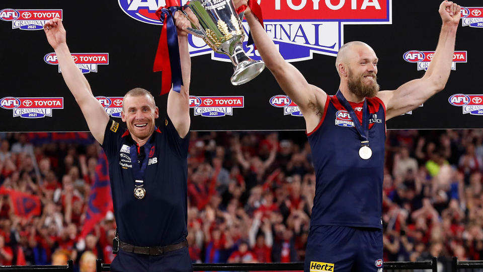 Simon Goodwin and Max Gawn, pictured here holding the cup aloft after the AFL grand final.