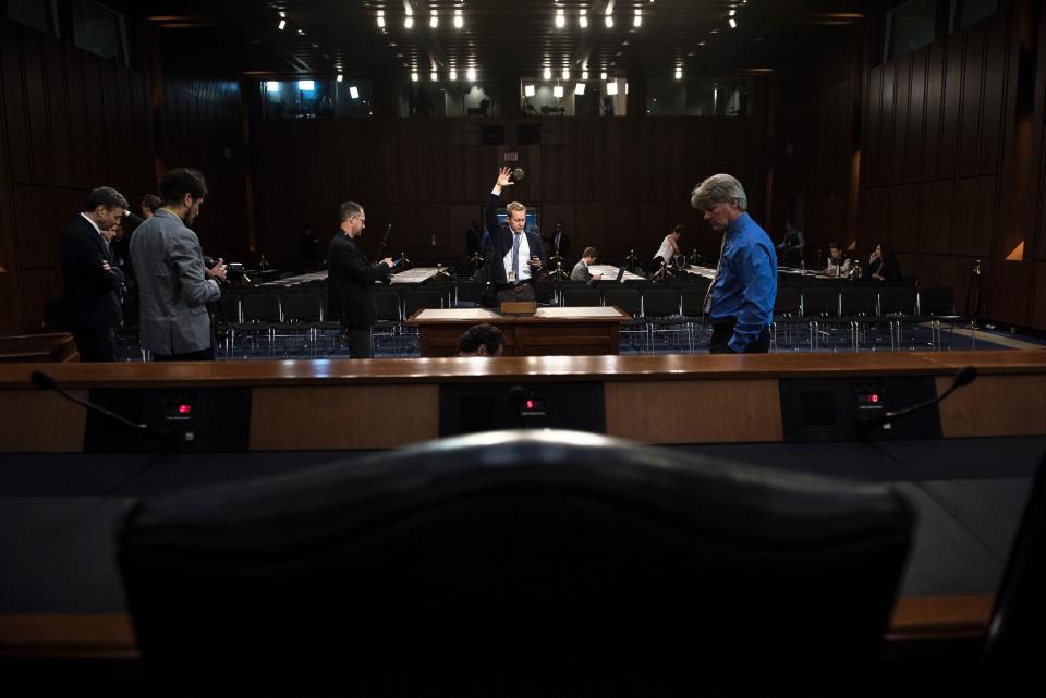 People make preparations for the hearing before the Senate Select Committee on Intelligence.