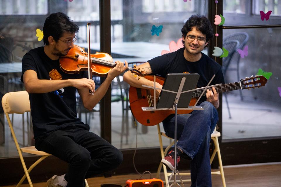 Pedro Maia and Otávio Kavakama, artist fellows with the Iris Collective, play for seniors at Dorothy’s Place, a daycare center for adults with Alzheimer’s or dementia, in Memphis, Tenn., on Wednesday, April 10, 2024.