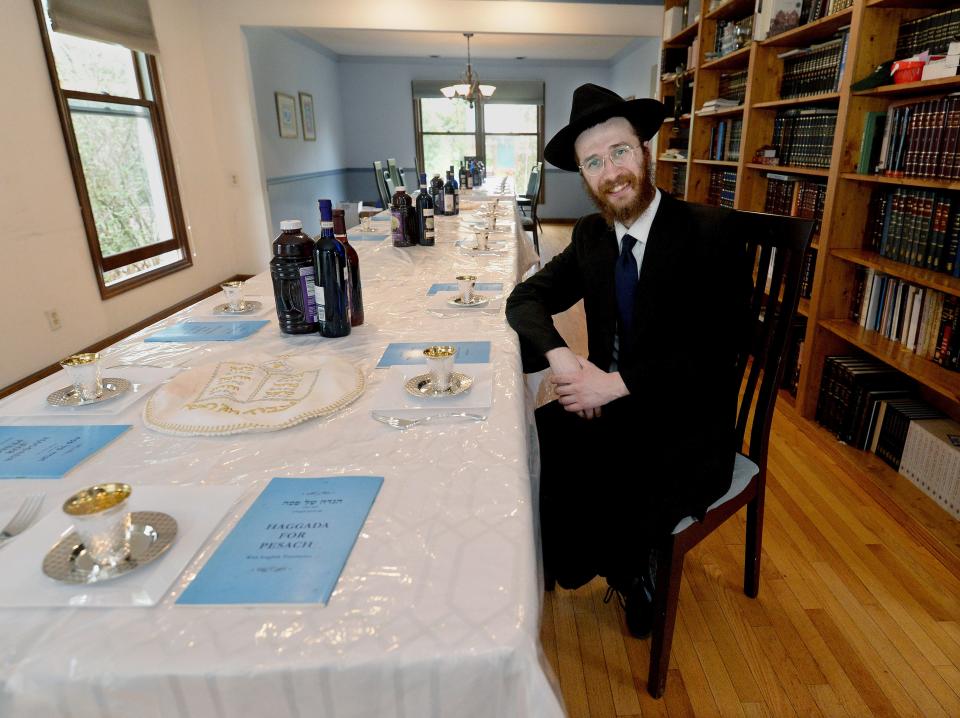 Rabbi Mendy Turen of Springfield at the Seder table in home Tuesday, April 4, 2023.