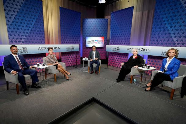 PHOTO: In this June 29, 2022, file photo, Republican candidates for Arizona governor from left to right, Scott Neely, Kari Lake, Paola Tulliani-Zen, and Karrin Taylor Robson, join moderator host Ted Simons, middle, on the set in Phoenix. (Ross D. Franklin/AP, FILE)
