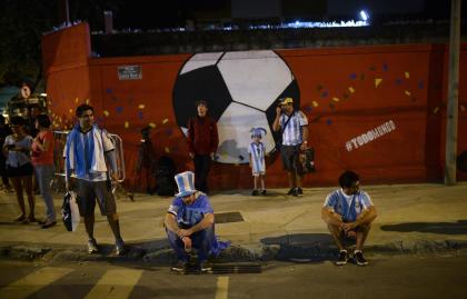 Dejected Argentina fans lament their team's loss to Germany in the World Cup final. (AP)