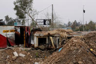 Islamic State signs are pictured in Bad el Beid area during a battle between Iraqi forces and Islamic State militants, in the city of Mosul. REUTERS/Youssef Boudlal