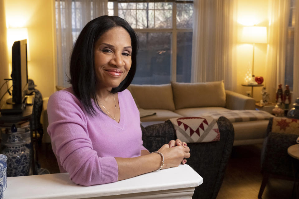 Janet Piroleau poses for a photo on Thursday, Dec. 29, 2022, at her home in Atlanta. Piroleau left the Democratic Party in 2016, during Trump’s first run for office, and now votes Republican. (AP Photo/Ben Gray)