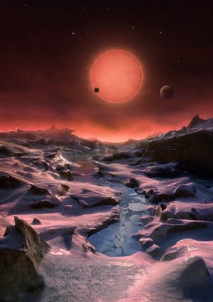 This artist's illustration depicts an imagined view from the surface of one of the three newfound TRAPPIST-1 alien planets. The planets have sizes and temperatures similar to those of Venus and Earth, mak