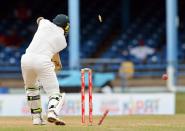 Australian batsman Ben Hilfenhaus is bowled out by West Indies Kemar Roach during the final day of the second-of-three Test matches between Australia and West Indies April19, 2012 at Queen's Park Oval in Port of Spain, Trinidad.