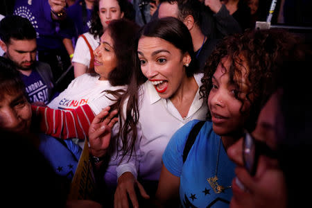 Democratic congressional candidate Alexandria Ocasio-Cortez greets supporters at her midterm election night party in New York City, U.S. November 6, 2018. REUTERS/Andrew Kelly