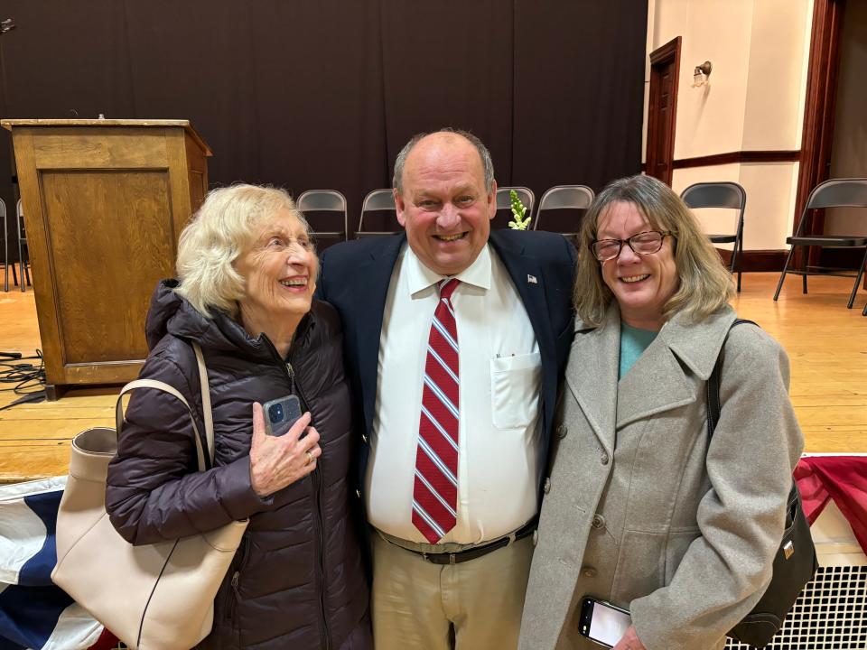 Dover Mayor Bob Carrier is flanked by his partner Kathleen Morrison (right) and her mother, Anne Morrison, after the city's inauguration for elected officials on Tuesday, Jan. 2, 2024. Carrier was sworn in for his third and final term as mayor.