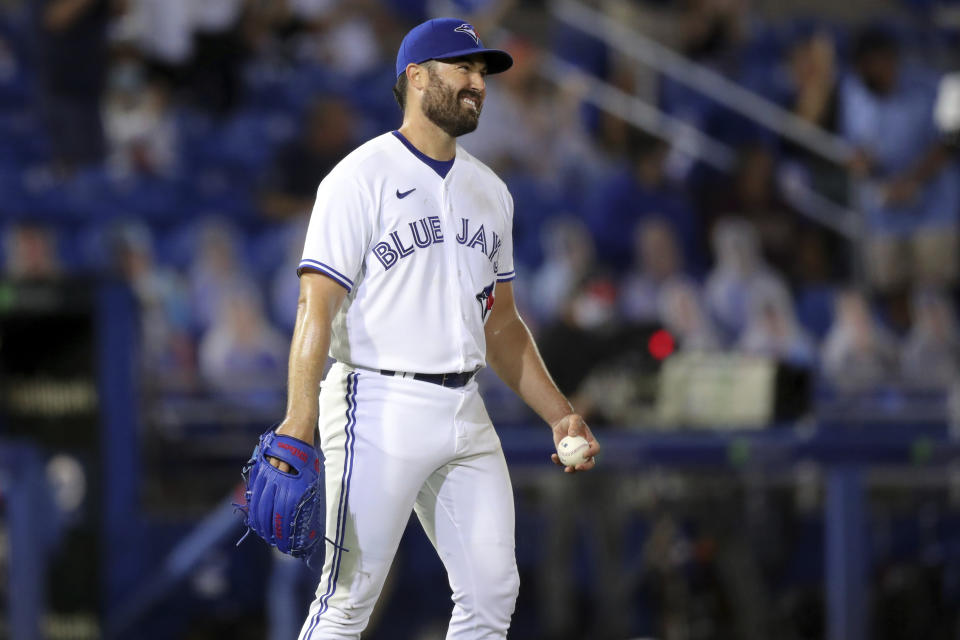 Toronto Blue Jays starting pitcher Robbie Ray reacts after giving up a two-run home run to New York Yankees' Kyle Higashioka during the fifth inning of a baseball game Monday, April 12, 2021, in Dunedin, Fla. (AP Photo/Mike Carlson)