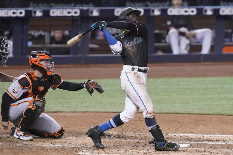 Miami Marlins' Jazz Chisholm Jr. hits a home run during the fifth inning of a baseball game against the San Francisco Giants, Friday, April 16, 2021, in Miami. (AP Photo/Marta Lavandier)