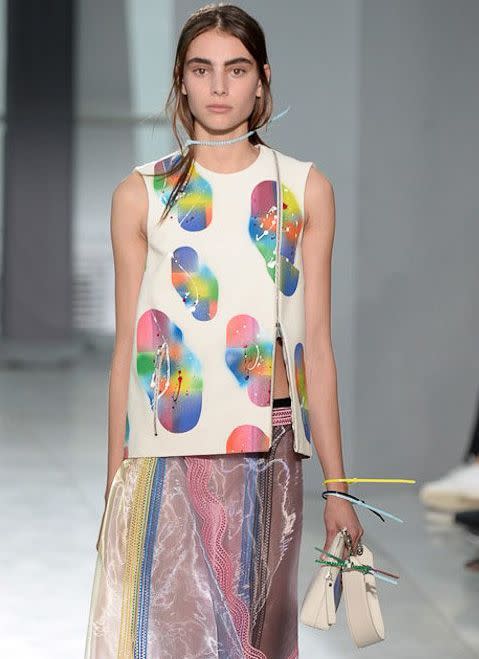 <p>Christopher Kane showed flirty, feminine dresses in pastels and paint-splattered patterns today, but it was his zip tie accessory that got me excited. Those plastic little ties you use to cinch up trash bags were cleverly repurposed here as colorful necklaces, bracelets, hairbands and belts. In his program notes Kane wrote, “The CK girl might be damaged goods this season but her power comes from the individuality of her outsider experience and her refusal to pay attention to rules.” There was certainly an outsider vibe to the look (think 90’s homemade rave scene!), but it certainly wasn’t rubbish material. In fact, I’m ready to tie one on!</p>