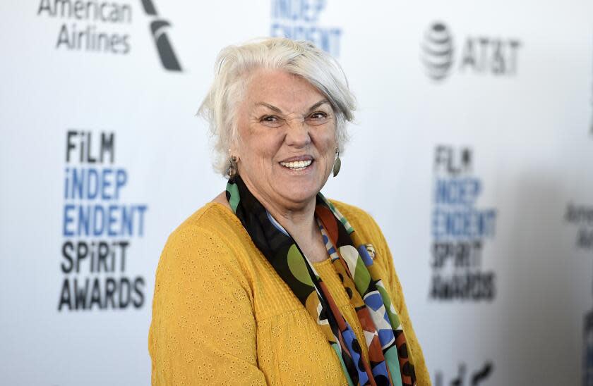 Tyne Daly in yellow blouse and multicolor scarf at Film Independent Spirit Awards carpet