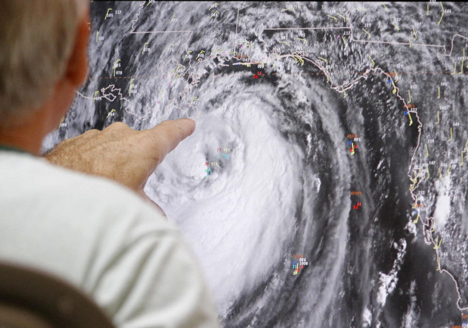 Senior hurricane specialist Stacy Stewart tracks Isaac at the National Hurricane Center in Miami, Tuesday, Aug. 28, 2012. Forecasters at the National Hurricane Center warned that Isaac, especially if it strikes at high tide, could cause storm surges of up to 12 feet (3.6 meters) along the coasts of southeast Louisiana and Mississippi and up to 6 feet (1.8 meters) as far away as the Florida Panhandle. (AP Photo/Alan Diaz)