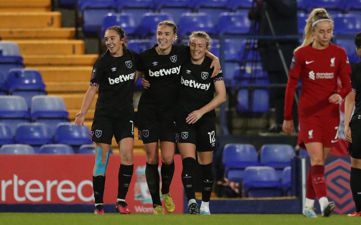 Dagny Brynjarsdottir of West Ham United (C) celebrates with Lisa Evans and Kate Longhurst after scoring their side's first goal during the FA Women's Continental Tyres League Cup match between Liverpool and West Ham United at Prenton Park - Lewis Storey/The FA via Getty Images