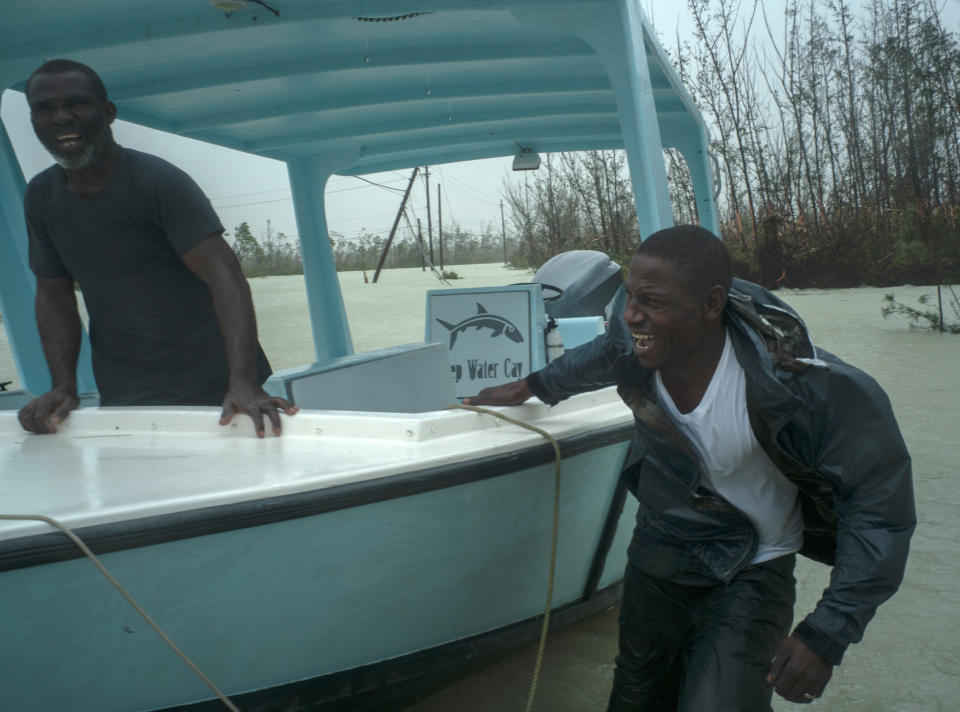 Volunteers get ready depart on a motor-boat to rescue people trapped by the rising waters of Hurricane Dorian, on a flooded road near the Causarina bridge in Freeport, Grand Bahama, Bahamas, Tuesday, Sept. 3, 2019. The storm’s punishing winds and muddy brown floodwaters devastated thousands of homes, crippled hospitals and trapped people in attics. (AP Photo/Ramon Espinosa)