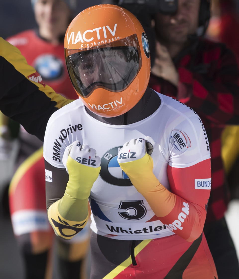 Germany's Tina Hermann celebrates after winning the women's event at the Skeleton World Championships in Whistler, British Columbia, Friday, March 8, 2019. (Darryl Dyck/The Canadian Press via AP)