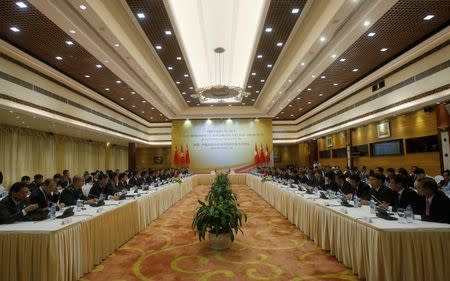 China's State Councilor Yang Jiechi (10th L) and Vietnam's Deputy Prime Minister and Foreign Minister Pham Binh Minh (12th R) attend the 9th meeting of the steering committee of the Vietnam - China bilateral cooperation at the International Convention Center in Hanoi, Vietnam June 27, 2016. REUTERS/Kham